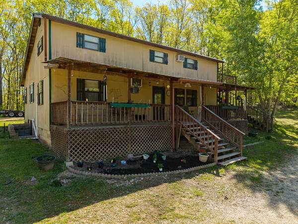 7 Acres of Land with Home for Sale in Norwood, Missouri