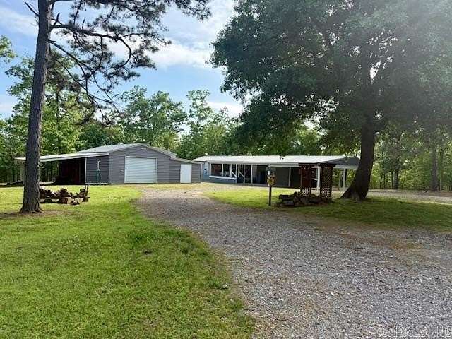 6.89 Acres of Land with Home for Sale in Story, Arkansas