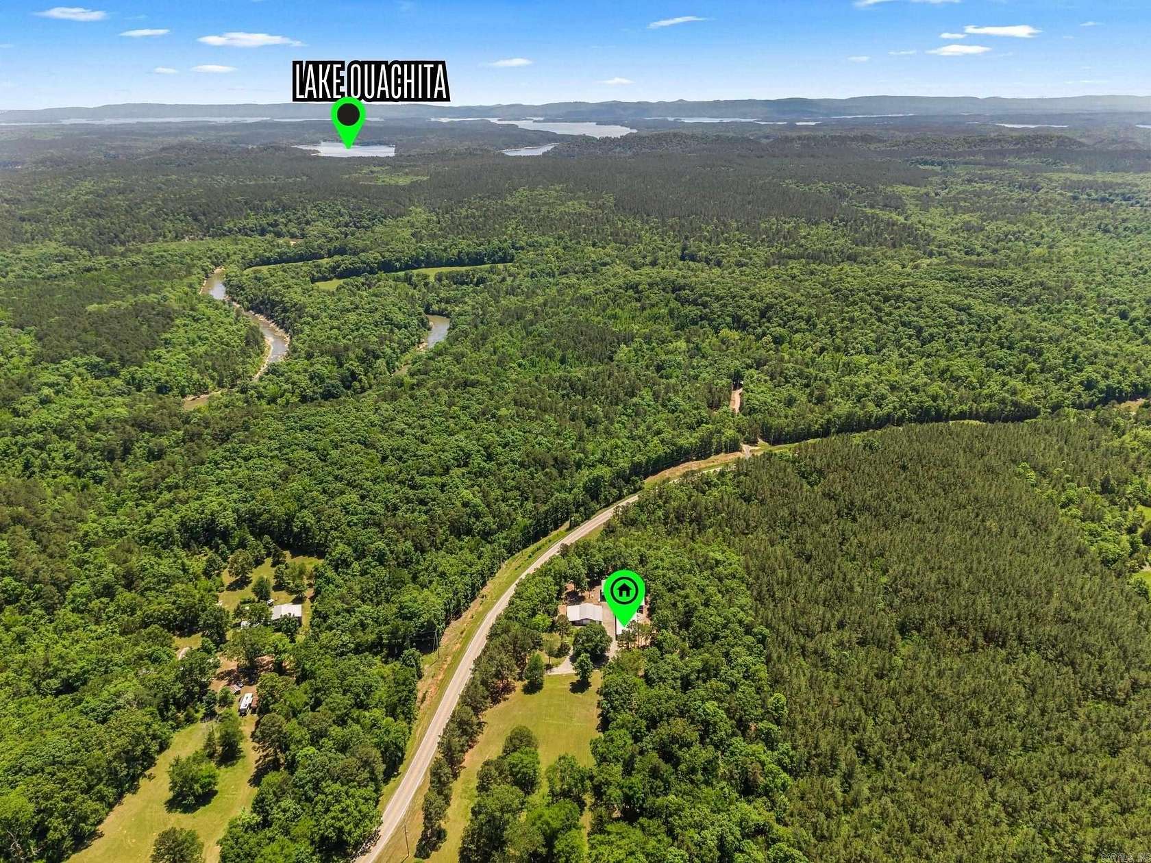 6.89 Acres of Land with Home for Sale in Story, Arkansas