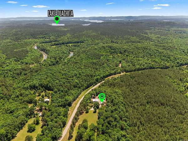 6.89 Acres of Land with Home for Sale in Story, Arkansas