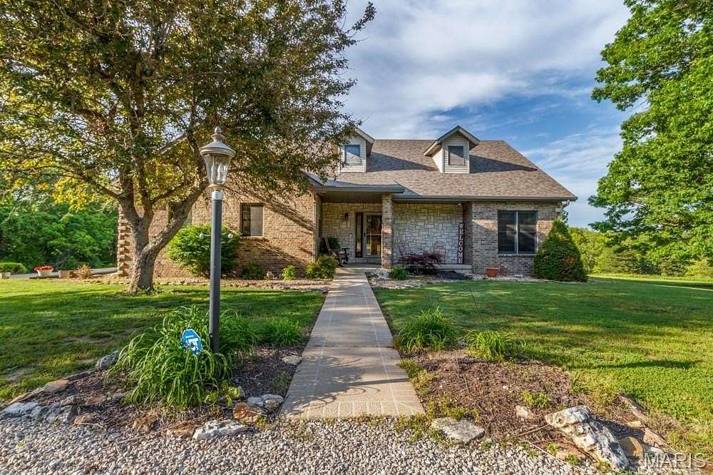 81.4 Acres of Recreational Land with Home for Sale in Lebanon, Missouri