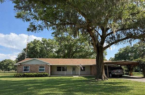 10.4 Acres of Land with Home for Sale in Citra, Florida
