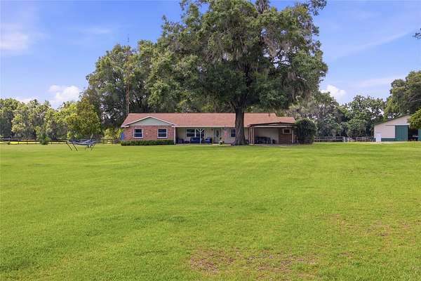 10.4 Acres of Land with Home for Sale in Citra, Florida