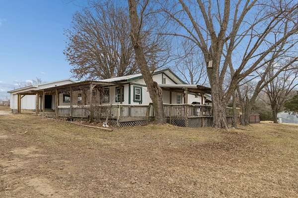5 Acres of Land with Home for Sale in Humansville, Missouri