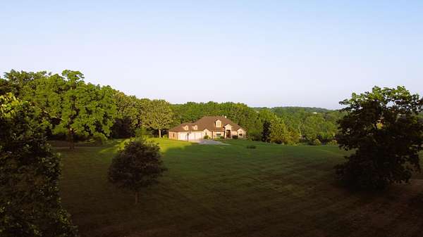 6.7 Acres of Land with Home for Sale in Bois D'Arc, Missouri