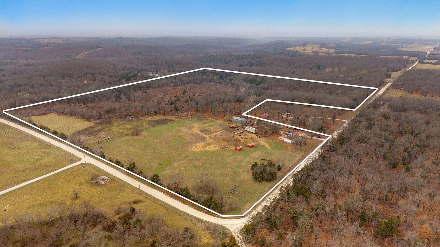 57 Acres of Agricultural Land with Home for Sale in Bolivar, Missouri