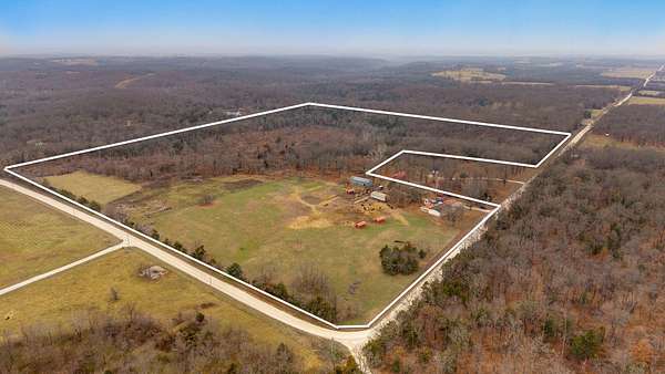 57 Acres of Agricultural Land with Home for Sale in Bolivar, Missouri
