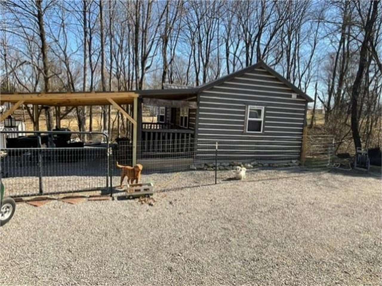 0.72 Acres of Land with Home for Sale in Scottsville, Kentucky