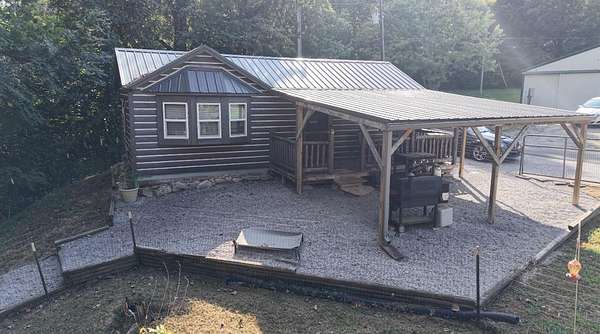 0.72 Acres of Land with Home for Sale in Scottsville, Kentucky