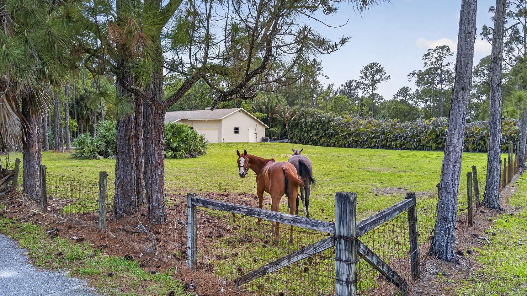 2.82 Acres of Land with Home for Sale in The Acreage, Florida
