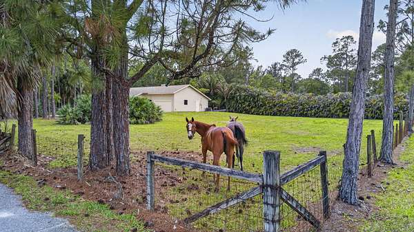 2.82 Acres of Land with Home for Sale in The Acreage, Florida