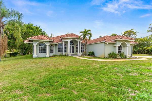 5 Acres of Land with Home for Sale in Loxahatchee Groves, Florida