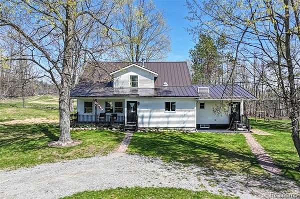 54.3 Acres of Land with Home for Sale in Elmer Township, Michigan