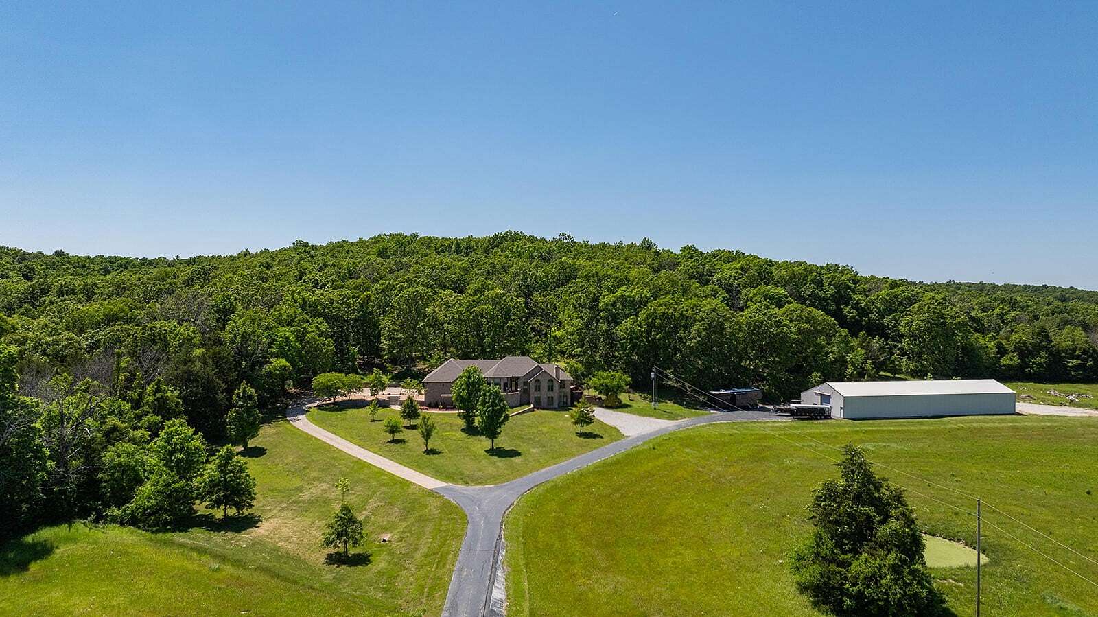 90 Acres of Land with Home for Sale in Fair Grove, Missouri