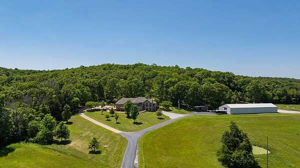 90 Acres of Land with Home for Sale in Fair Grove, Missouri