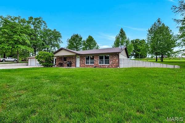 9.18 Acres of Land with Home for Sale in Winfield, Missouri