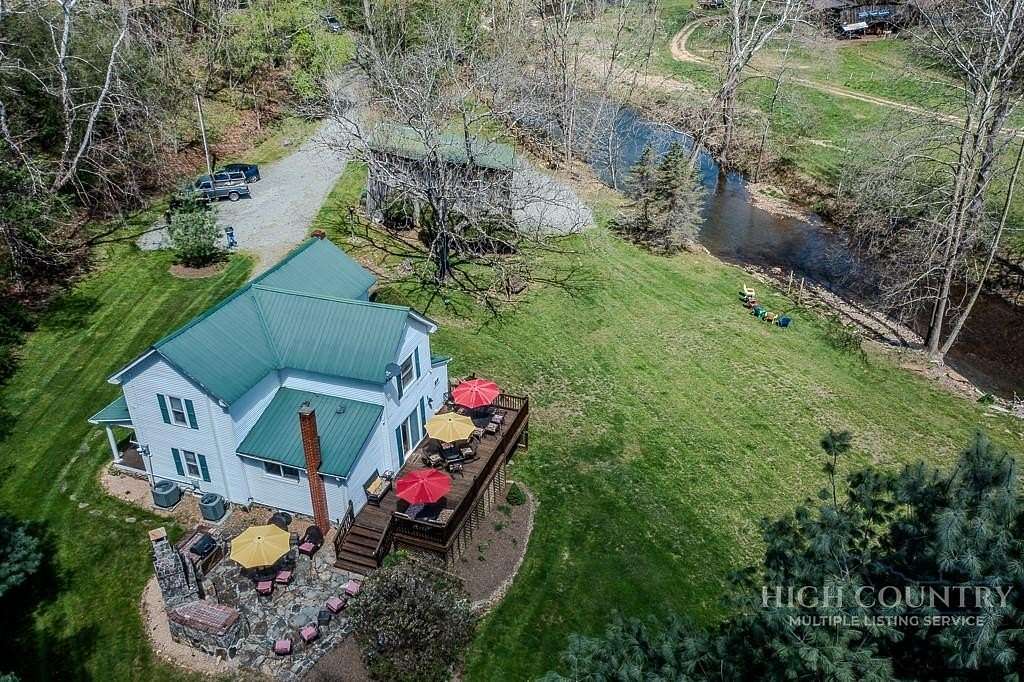 7.9 Acres of Land with Home for Sale in Grassy Creek, North Carolina