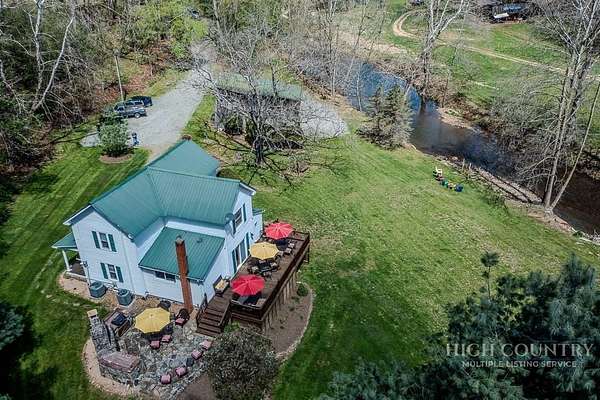7.9 Acres of Land with Home for Sale in Grassy Creek, North Carolina