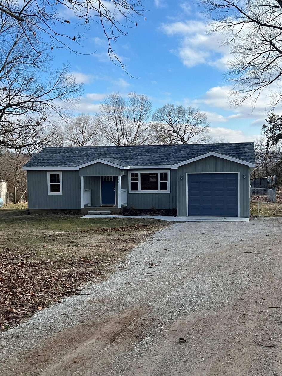 11.7 Acres of Recreational Land with Home for Sale in Lampe, Missouri