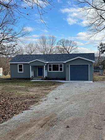 11.7 Acres of Recreational Land with Home for Sale in Lampe, Missouri