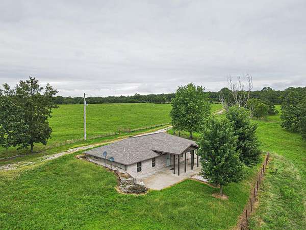 40 Acres of Agricultural Land with Home for Sale in Macks Creek, Missouri