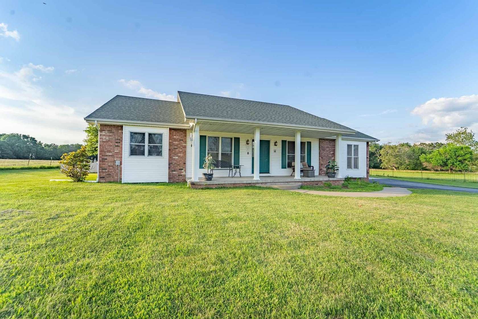 33.6 Acres of Agricultural Land with Home for Sale in Bolivar, Missouri