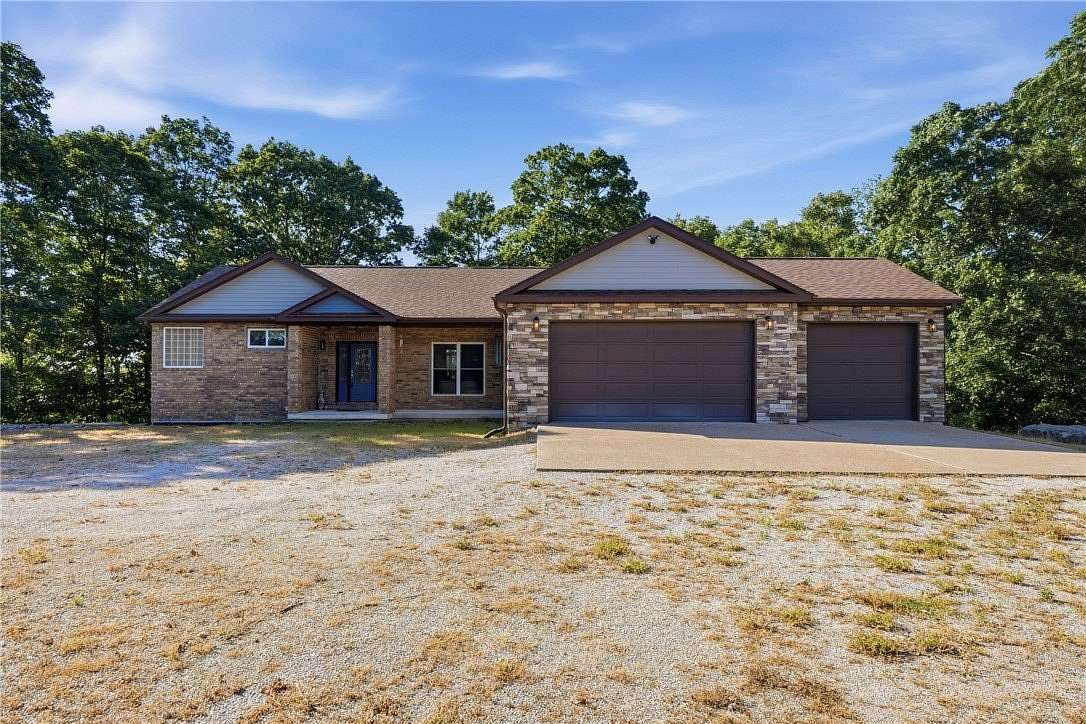 5 Acres of Land with Home for Sale in Holiday Island, Arkansas