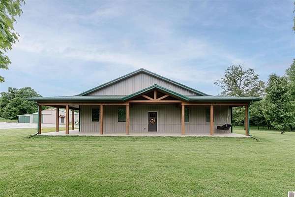 13.9 Acres of Land with Home for Sale in Mayfield, Kentucky