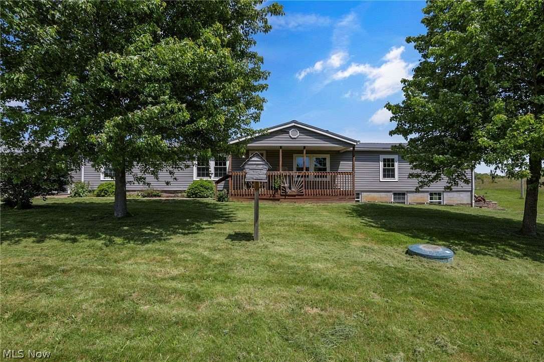 19.8 Acres of Land with Home for Sale in Kimbolton, Ohio