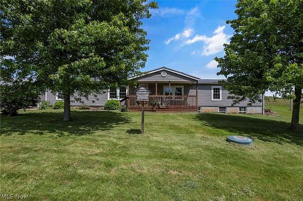 19.8 Acres of Land with Home for Sale in Kimbolton, Ohio