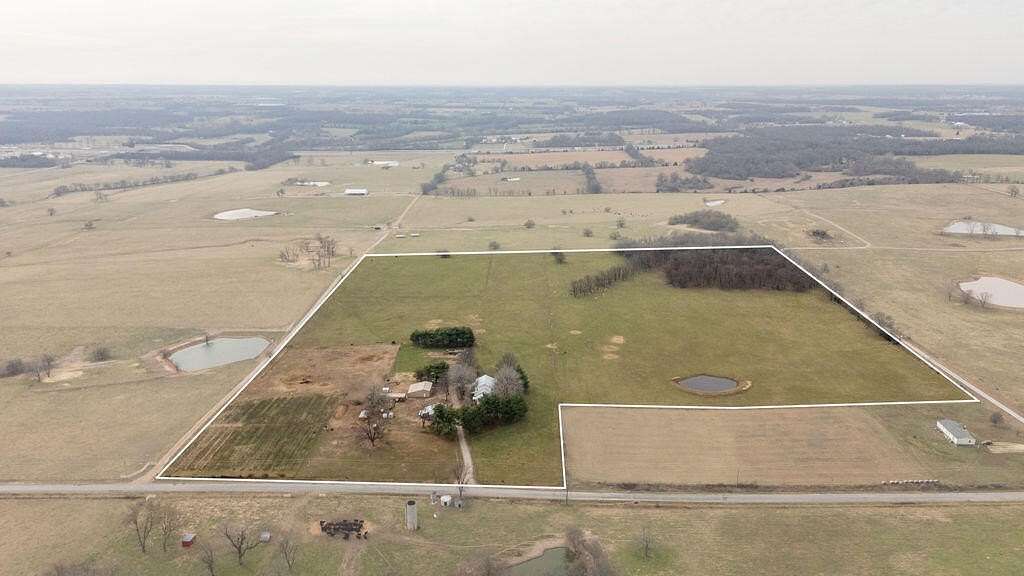 39.6 Acres of Agricultural Land with Home for Sale in Stotts City, Missouri