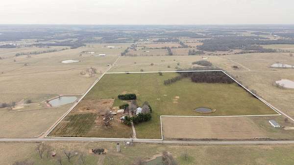 39.6 Acres of Agricultural Land with Home for Sale in Stotts City, Missouri