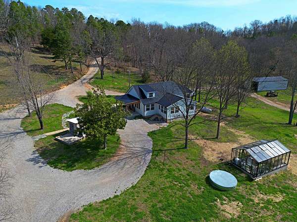 92 Acres of Agricultural Land with Home for Sale in Norwood, Missouri