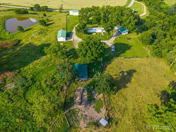 64 Acres of Agricultural Land with Home for Sale in Birch Tree, Missouri