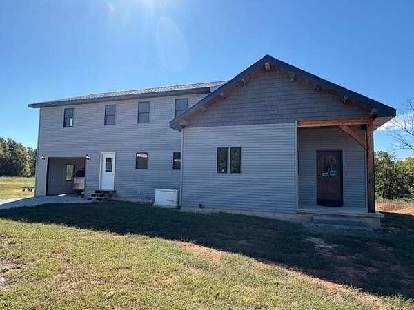 104 Acres of Recreational Land with Home for Sale in Galena, Missouri