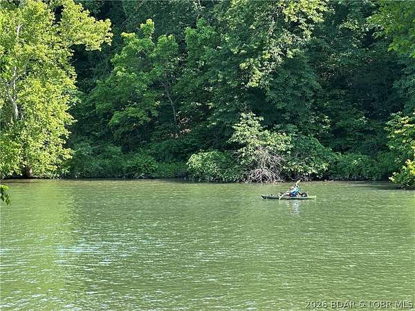 11.5 Acres of Recreational Land with Home for Sale in Roach, Missouri