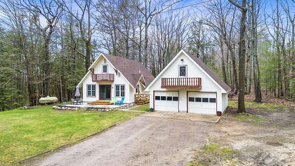 1.52 Acres of Land with Home for Sale in Indian River, Michigan