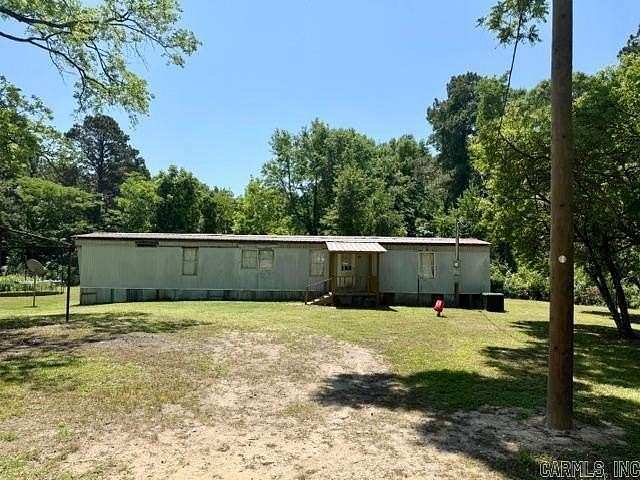 12.6 Acres of Land with Home for Sale in El Dorado, Arkansas