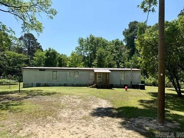 12.6 Acres of Land with Home for Sale in El Dorado, Arkansas