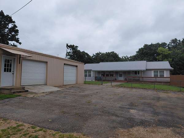 4.4 Acres of Land with Home for Sale in Macks Creek, Missouri