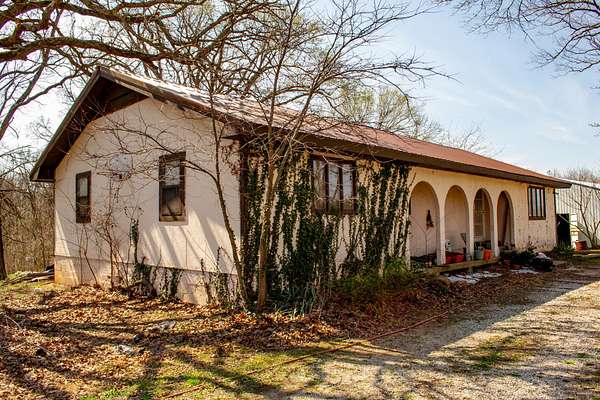 7.7 Acres of Land with Home for Sale in Arcola, Missouri