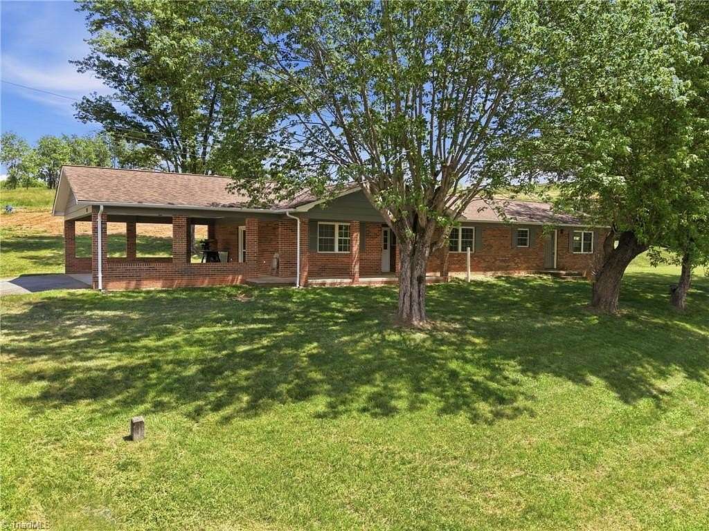 9 Acres of Land with Home for Sale in Purlear, North Carolina