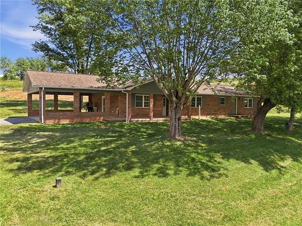 9 Acres of Land with Home for Sale in Purlear, North Carolina