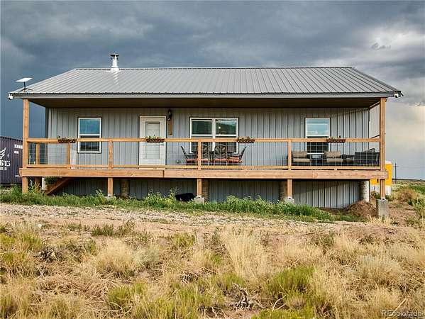 15.6 Acres of Land with Home for Sale in Fort Garland, Colorado