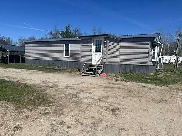 2.5 Acres of Land with Home for Sale in Pellston, Michigan