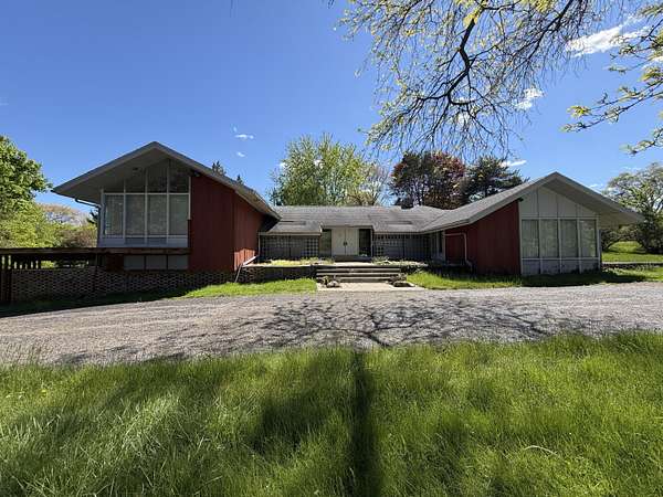 2.3 Acres of Land with Home for Auction in Flint, Michigan
