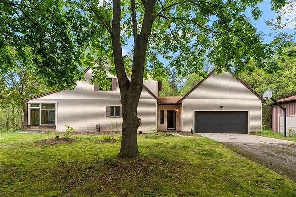 3.15 Acres of Land with Home for Sale in Rockford, Michigan