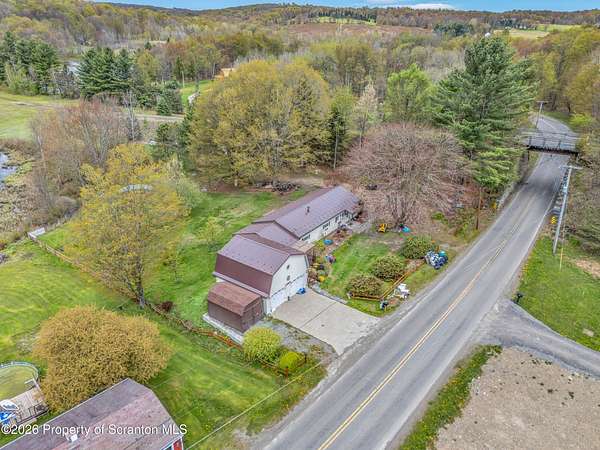 10.6 Acres of Land with Home for Sale in Thompson, Pennsylvania
