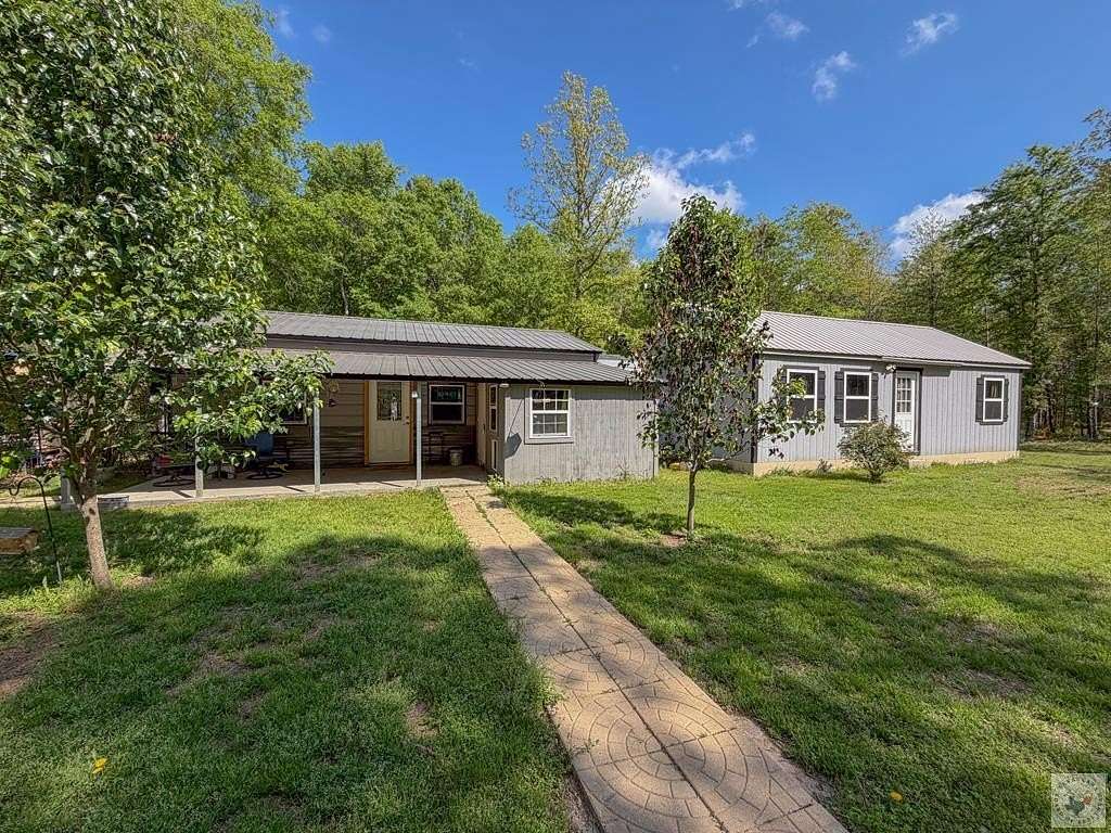 12.7 Acres of Recreational Land with Home for Sale in De Kalb, Texas