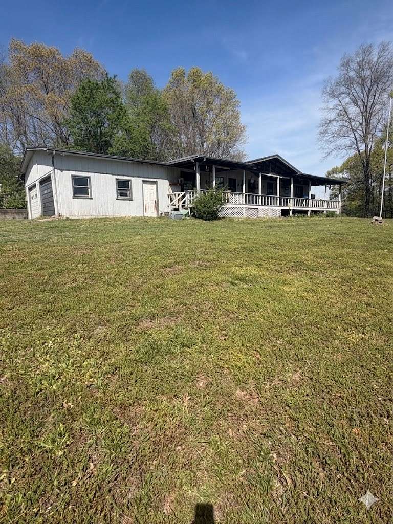 12.8 Acres of Recreational Land with Home for Sale in Woodlawn, Tennessee